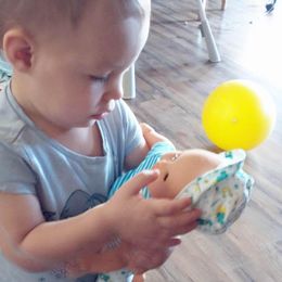 Customer photo from the review "She is LOVING this baby!"