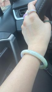 The colors are so elegant and calming — soft green with a gentle hint of lavender. It feels alive on my wrist, with a subtle glow that changes under the light. Beautiful craftsmanship and excellent quality!