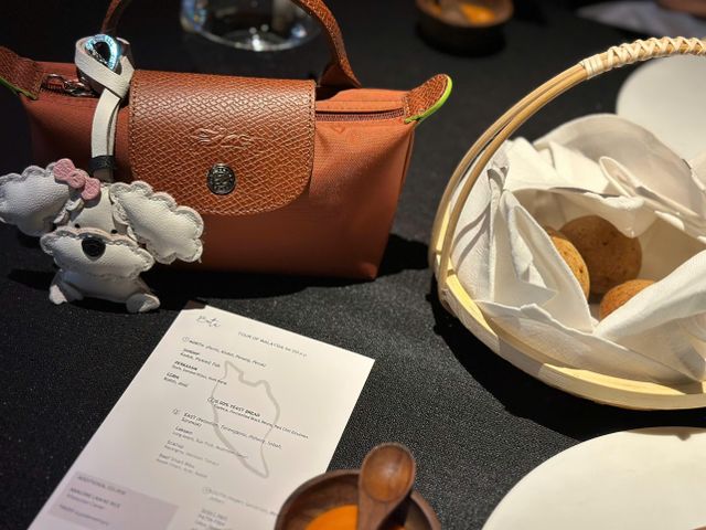 Artisan hand stitching a premium leather dog charm