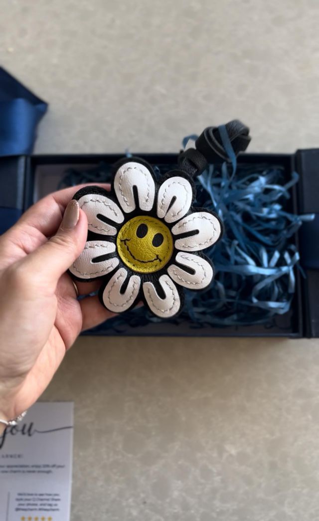 Opening a handcrafted leather bag charm for the first time