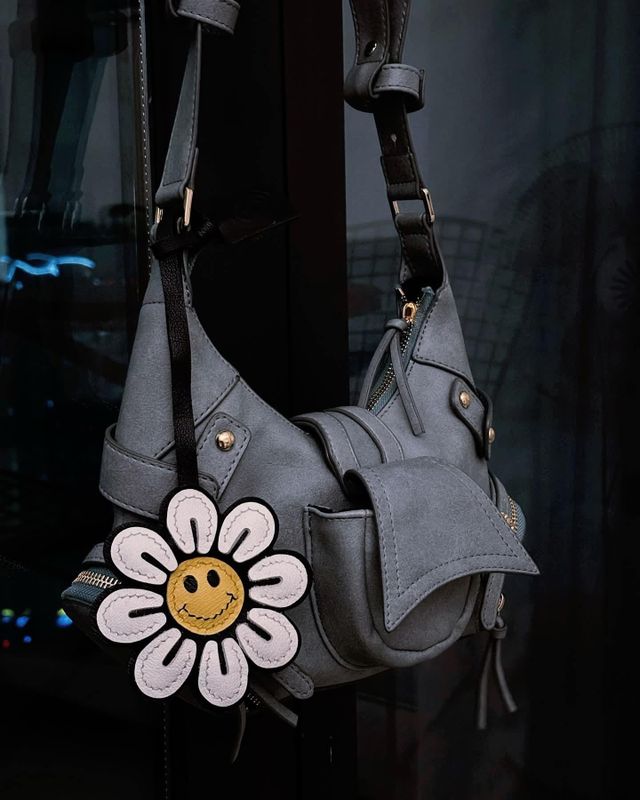 Leather bag charm styled on a casual handbag for weekend outings